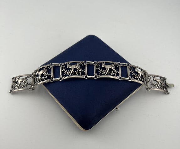 Art Deco Sterling Panel Bracelet w Deer Motif: Antique Art Deco Sterling Silver Panel Bracelet w Deer Motif. Stamped on the clasp. Measures approximately 7 inches in length.