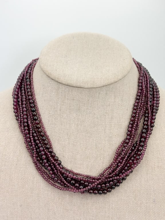 Garnet Multi Strand Bead Necklace w Gold Toggle: Garnet Multi Strand Bead Necklace w Gold Toggle Clasp. Measures 16.5 inches in length. Acid tests for 14kt gold, may be gold filled as there is no hallmark.