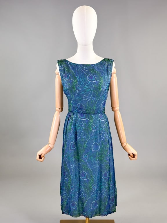 Vintage 1950s Silk Peacock Print Chiffon Day Dress: Vintage 1950s Silk Peacock Print Chiffon Day Dress having print throughout with back zip closure. Labeled POSH - De Pinna Young Couture Shop. Measuring 38 inch bust, 28 inch waist, 41 inches long. Lig