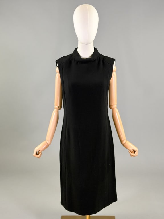 Vintage 1960s Galanos Wool Crepe Shift Dress: Vintage 1960s Galanos Wool Crepe Shift Dress having mock turtleneck with belt back detail and two front pockets, closing at back and side with zips, fully lined. Labeled GALANOS. Measuring 38 inch bus