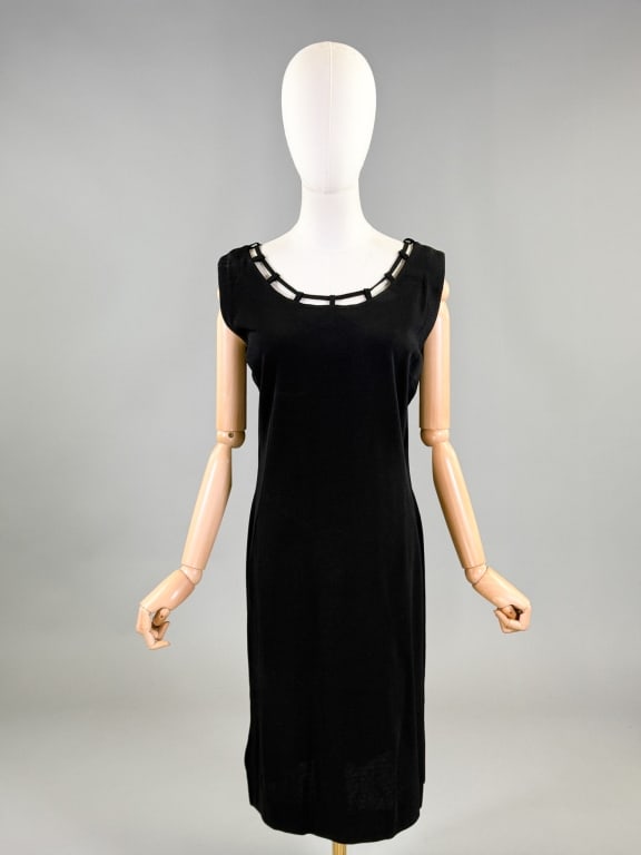 Vintage 1960s Pierany Paris Black Knit Dress: Vintage 1960s Pierany Paris Black Knit Dress having tie detail at neckline with center back zip closure. Labeled Pierany Paris 40 - 48 inch bust, 36 - 44 inch waist, 39 inches long. General wear throu