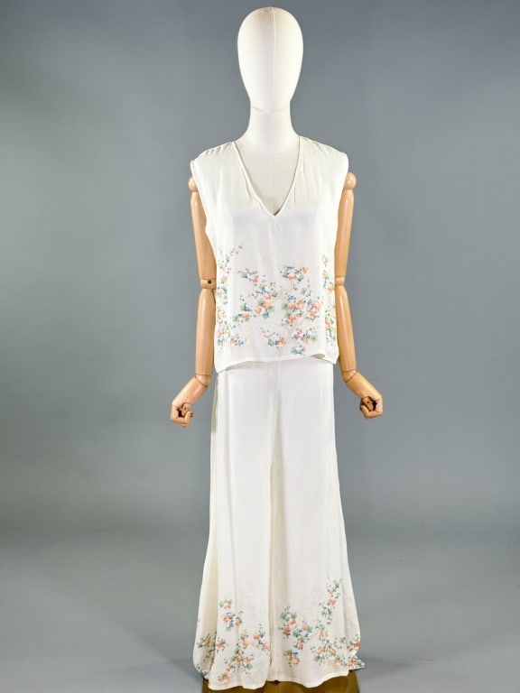 Vintage 1930s Rayon Floral Print Lounge Pajama Set: Vintage 1930s Rayon Floral Print Lounge Pajama Set having top with v-neckline and floral print at hem, and pants with elastic waist and floral print at hem. Top measuring 40 inch bust, 21 inches long.