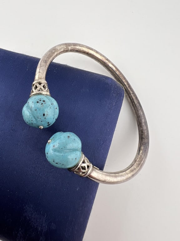 Sterling Silver & Carved Turquoise Bypass Bracelet: Sterling Silver & Carved Turquoise Bypass Bracelet. Hallmarked 925. Measures just over 2.25 inches across the interior opening.