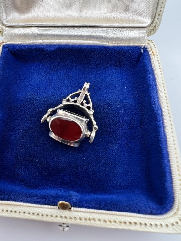 Sterling Silver Spinning Fob Necklace Pendant: Sterling Silver Spinning Fob Necklace Pendant. With black onyx, mother of pearl, carnelian. Measures just under 1.5 inches in length.
