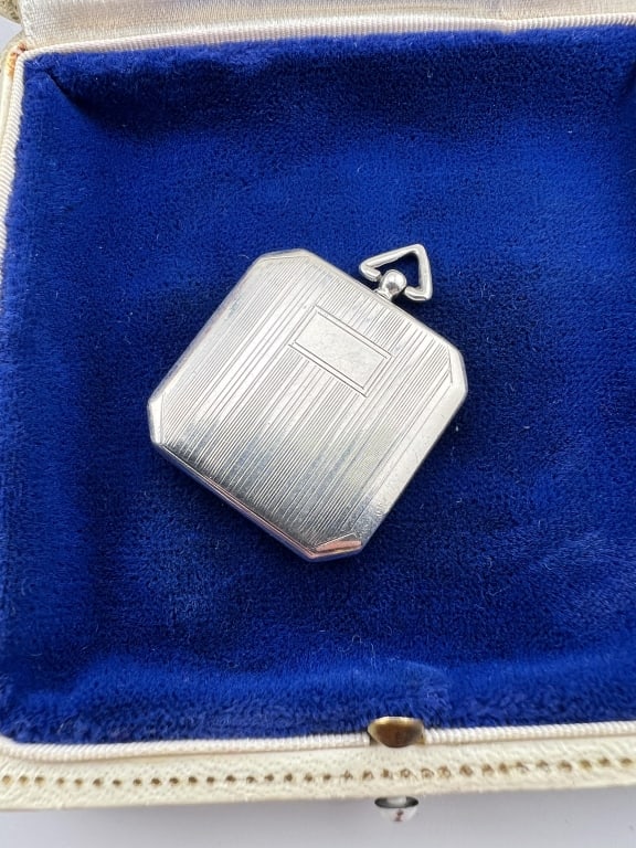 Antique Art Deco Sterling Silver Locket Pendant: Antique Art Deco Sterling Silver Locket Necklace Pendant. Stamped interior with accompanying hallmarks. Measures 1.5 inches in length.