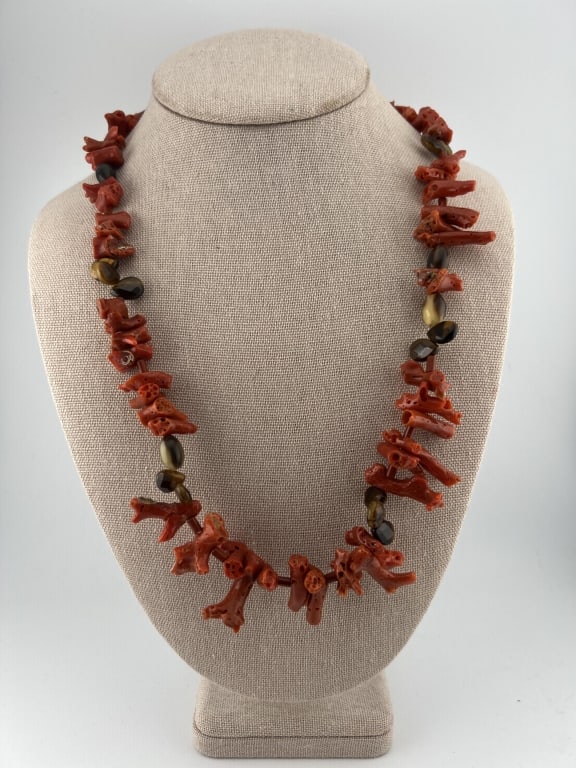 Sterling Silver Coral & Tigers Eye Beaded Necklace: Sterling Silver Coral & Tigers Eye Beaded Necklace. Set with branch coral beads, faceted tiger's eye beads and sterling silver clasp. Measures 22 inches in length.