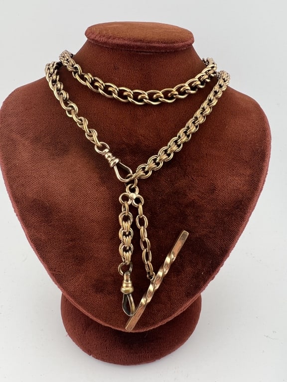 Antique 19th C Gold Filled Watch Chain Necklace: Antique 19th C Gold Filled Watch Chain Necklace. With T bar and two dog clips. Made with Georgian style watch chain and fancy knotted motif watch chain. Measures 22 inches in length, drop with T bar a