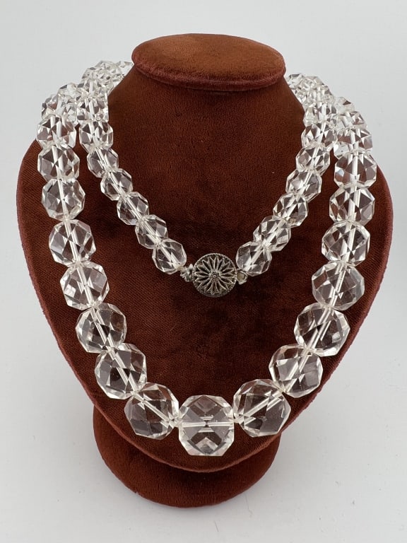 Antique Faceted Rock Crystal Bead Necklace Strand: Antique Faceted Rock Crystal Bead Necklace Strand. With filigree floral motif sterling silver clasp. Largest bead measures approximately .75 of an inch in width. Beads are graduated in size. Necklace 