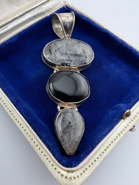 Large Sterling Silver & Rutilated Quartz Pendant: Large Sterling Silver Black Onyx & Rutilated Quartz Necklace Pendant. Hallmarked 925. Measures 3.5 inches in length.