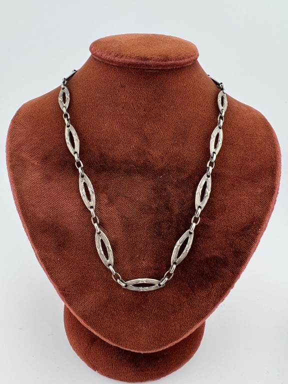 Antique Sterling Silver Neo Classical Necklace: Antique Sterling Silver Neo Classical Necklace Chain. Having alternating navette and oval links with reeded design. The spring ring is stamped STERLING. Measures 16.5 inches in length.
