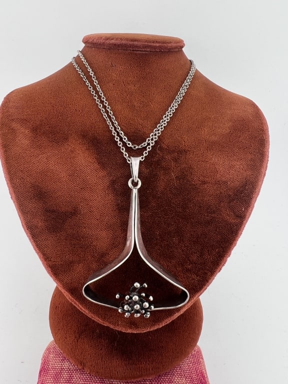 Mid Century Finland Sterling Silver Necklace: Vintage Mid Century Finland Sterling Silver Necklace. Pendant is stamped FINDLAND 925. Chain measures just under 20 inches in length.