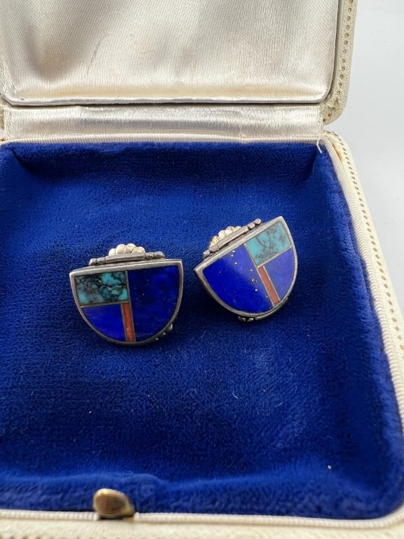 Sterling Native American Lapis Turquoise Earrings: Pair of Sterling Silver Lapis Lazuli Turquoise Earrings. Native American. Each measures .75 of an inch in length.