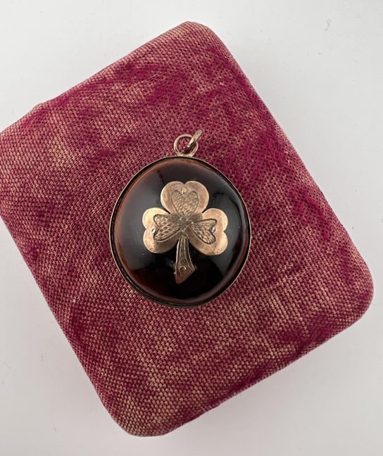 Antique 19th C Gold Mounted Sea Nut Pendant Fob: Antique 19th C Gold Mounted Sea Nut Pendant Fob. Elements acid test for 10kt gold, may be gold filled? Natural sea nut with three leaf clover mount on the front. Measures 1.5 inches in length.