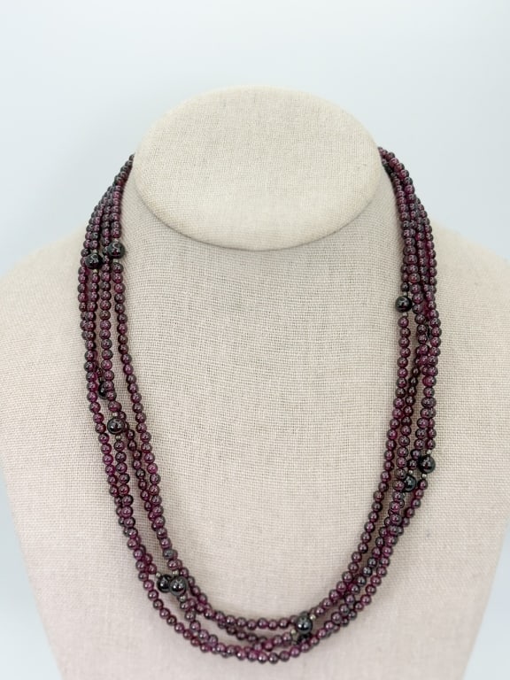 Vintage 80 Inch Garnet Beaded Necklace Strand: Vintage 80 Inch Garnet Beaded Necklace Strand. Having a sterling silver clasp.