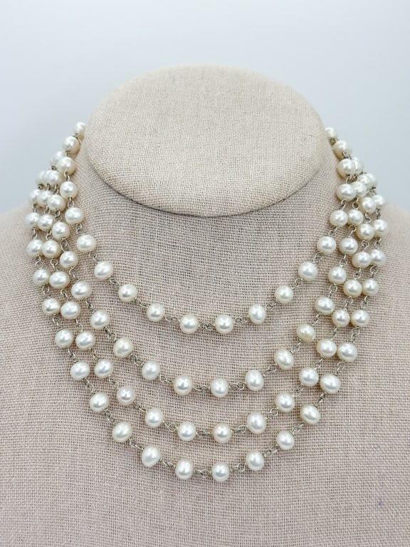 62 Inch Cultured Baroque Pearl Necklace Strand: 62 Inch Cultured Baroque Pearl Necklace Strand. With wire wrap attachments. Set with approximately 5 to 6mm cultured high luster white pearls each varying slightly in size and shape.