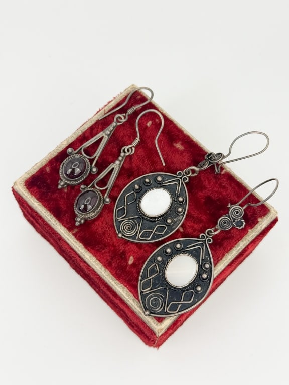 Sterling Silver Garnet & Mother of Pearl Earrings: Sterling Silver Garnet & Mother of Pearl Earrings. Two pairs of earrings, one is set with cabochon garnets and one with bezel set mother of pearl. Earrings measure approximately 2 and 2.5 inches in le