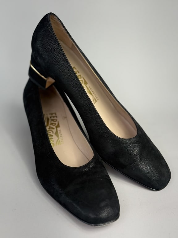 Vintage Black Salvatore Ferragamo Pumps Heels: Vintage Black Leather Salvatore Ferragamo Pumps Heels with short heel having gold tone signed metal accent. Labeled Salvatore Ferragamo Florence Made in Italy - marked size 7.5. Measuring approximatel