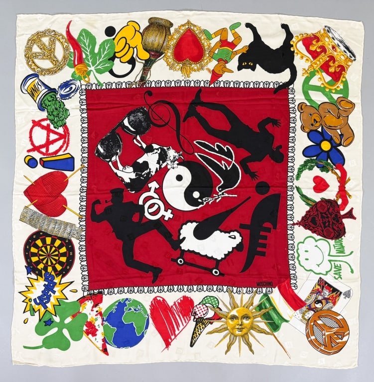 Vintage Moschino Novelty Print Silk Scarf: Vintage Moschino Novelty Print Silk Scarf having print throughout with hand rolled edges. Labeled Moschino - Made in Italy - 100% Silk. Measuring approximately 35 inches by 33 inches.