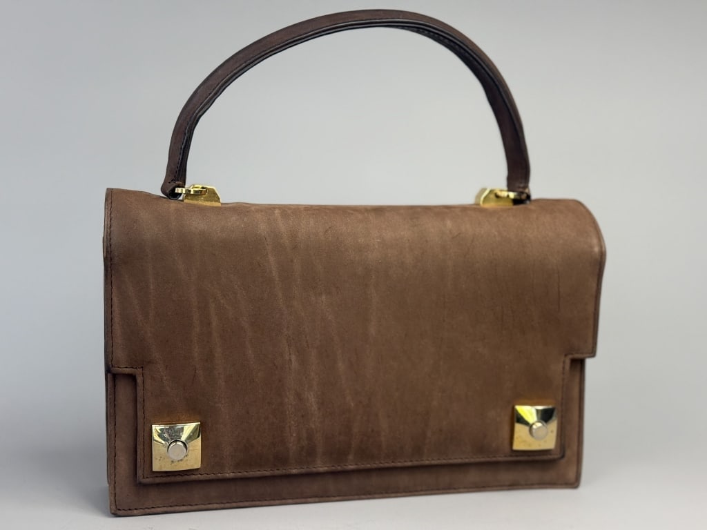 Vintage 1960s Brown Suede Top Handle Hand Bag: Vintage 1960s Brown Suede Top Handle Hand Bag Purse having gold tone locking closure at front with zippered interior pocket and separated compartments. Labeled Tano of Madrid Made in Spain. Measuring 
