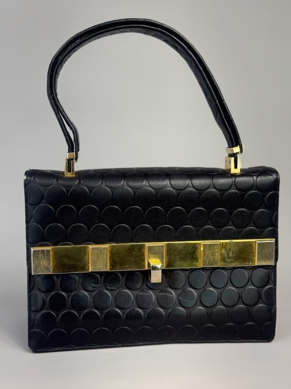 Vintage 1960s Koret Polka Dot Leather Box Hand Bag: Vintage 1960s Koret Polka Dot Leather Box Hand Bag having gold tone hardware with lock closure at front. Labeled Koret. Measuring approximately 9 inches wide by 6 inches tall by 3 inches deep with a 6