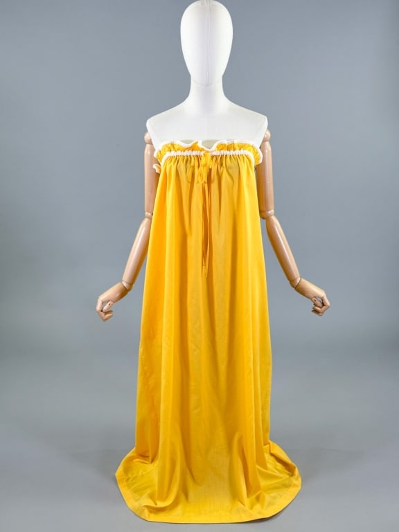 Vintage 1970s Geoffrey Beene Strapless Dress: Vintage 1970s Yellow Geoffrey Beene Strapless Dress having terrycloth trim details with tie at bust and pockets at side seam. Labeled Geoffrey Beene for Swirl - marked size P. Measuring adjustable bus