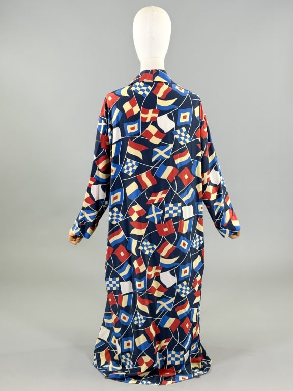 Vintage 1980s Calvin Klein Nautical Flag Robe: Vintage 1980s Calvin Klein Nautical Flag Print Robe having shawl collar, patch pocket at chest, and interior tie. Missing belt at waist. Labeled Calvin Klein - marked size S. Measuring 49 inches long,