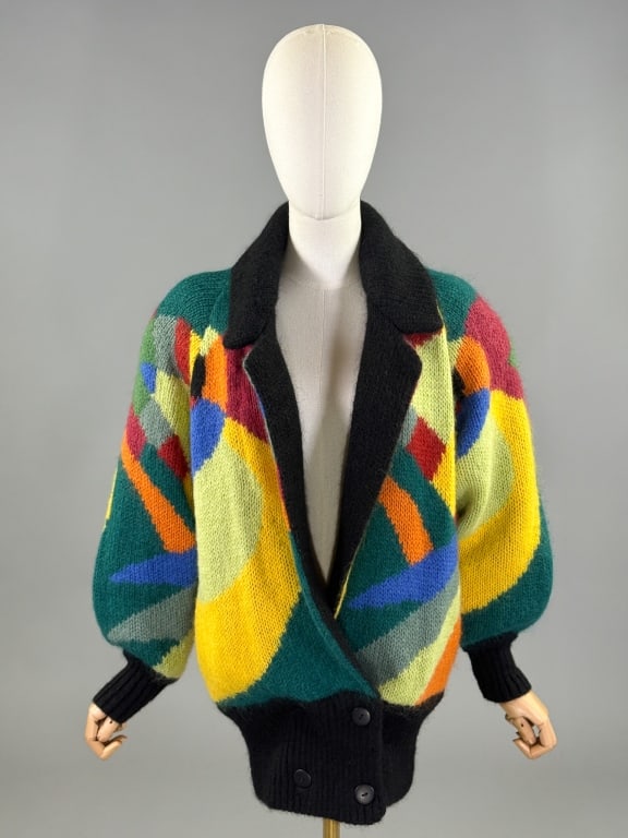 Vintage 1980s Aziza Wool Knit Color Block Sweater: Vintage 1980s Aziza Wool Knit Color Block Sweater having color block design throughout with notched lapel collar and double breasted button closure at hem. Fully lined. Labeled Aziza - One Size Fits A
