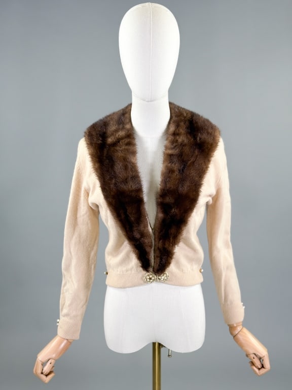 Vintage 1950s Mink Trim Knit Wool Cardigan Sweater: Vintage 1950s Mink Trim Knit Wool Cardigan Sweater having removable mink collar with pearl accents throughout and silk lining. Measuring 36 inch bust, 26 inch waist, 18 inches long, 20 inch sleeve len