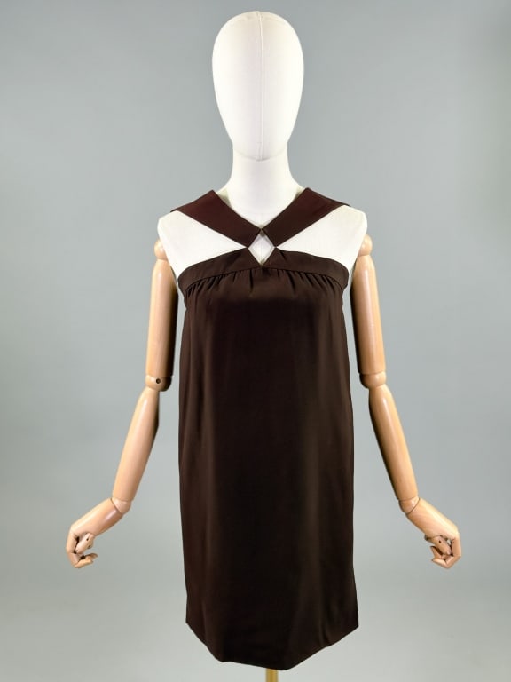 Vintage 1960s Lord & Taylor Mod Mini Cut Out Dress: Vintage 1960s Lord & Taylor Mod Mini Cut Out Dress having cut out details at bust with center back zip closure, fully lined. Labeled Lord & Taylor. Measuring 32 inch bust, 34 inch waist, 35 inches lon