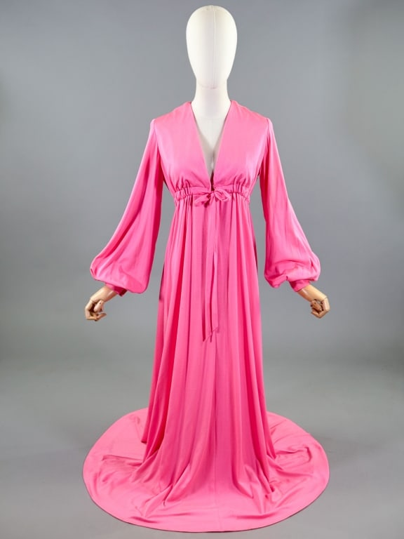 Vintage 1970s Outrageous Knit Maxi Lounge Dress: Vintage 1970s Outrageous Knit Maxi Lounge Dress having adjustable empire waist with tie & long bishop sleeves, with stretch throughout. Labeled Outrageous New York. Measuring 36 inch bust, adjustable 