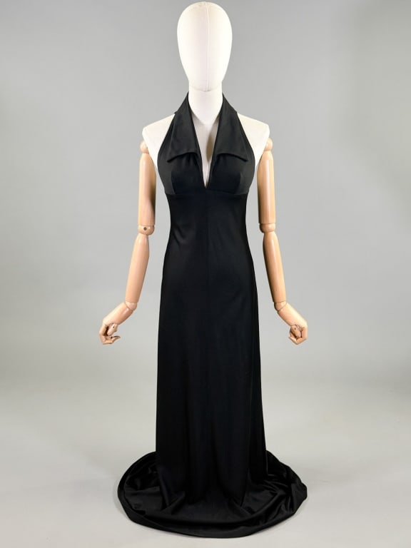 Vintage 1970s Manning Silver Knit Halter Dress: Vintage 1970s Manning Silver Knit Maxi Halter Dress having collar at neck with halter neckline and center back zip closure. Labeled Manning Silver. Measuring free bust, 30 inch waist under bust, 57 in