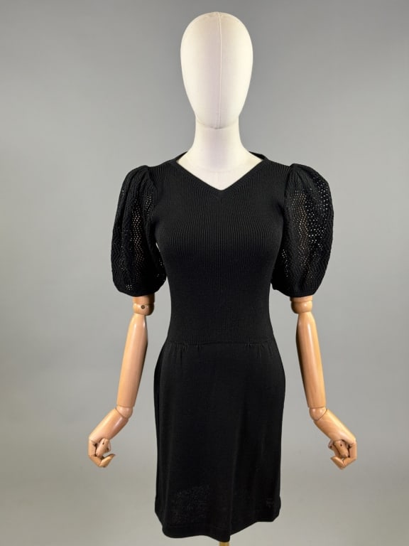 Vintage St. John Knit Puff Sleeve Drop Waist Dress: Vintage St. John Knit Puff Sleeve Drop Waist Dress having openwork puffed sleeves with v-neckline and drop waist with center back zip closure. Labeled St. John by Marie Gray - Neiman Marcus. Measuring