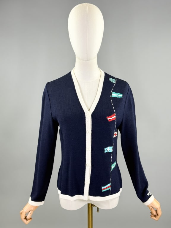 Vintage St. John Sport Knit Cardigan Sweater: Vintage St. John Sport Knit Cardigan Sweater having button front closure. Labeled St. John Sport by Marie Gray - marked size P. Measuring 36 - 40 inch bust, 22 inches long, 22 inch sleeve length.