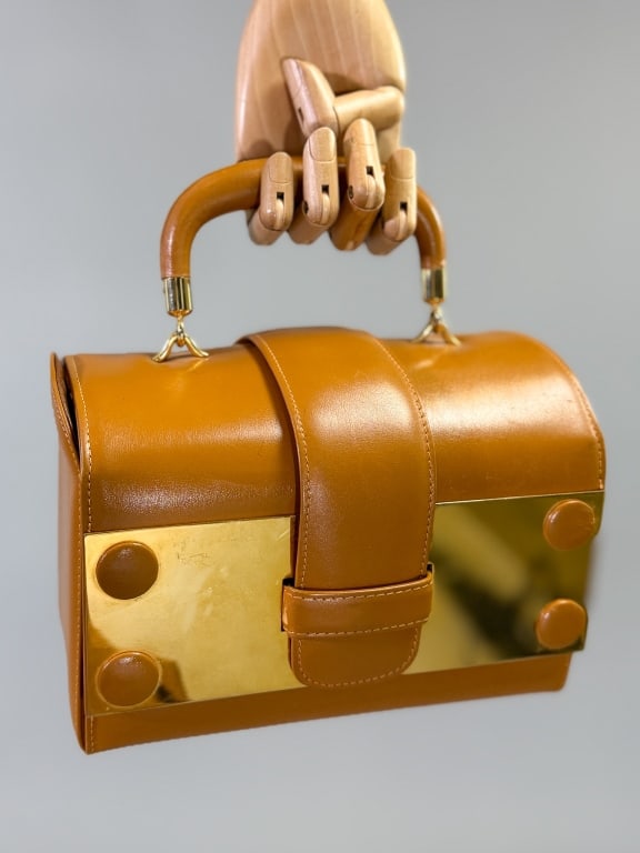 Vintage 1960s Sacha Box Leather Hand Bag Purse: Vintage 1960s Sacha Box Leather Hand Bag Purse having metal detail at front with top handle and locking closure at front with interior pockets. Labeled Sacha Genuine Box. Measuring approximately 8