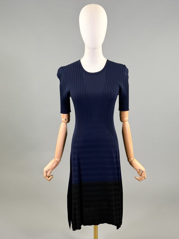 Opening Ceremony Rib Knit Sportswear Dress: Opening Ceremony Rib Knit Sportswear Dress having crew neck with short sleeves and handkerchief hem, knit throughout with stretch. Labeled Opening Ceremony Est. 2002 - marked size S. Original tag
