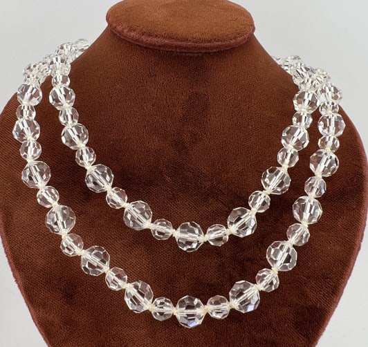 Antique Art Deco 14kt Gold Rock Crystal Necklace: Antique Art Deco Era 14kt Yellow Gold & Faceted Rock Crystal Flapper Necklace. Clasp is hallmarked and possibly a later replacement. Measures 29 inches in length. Hand knotted.