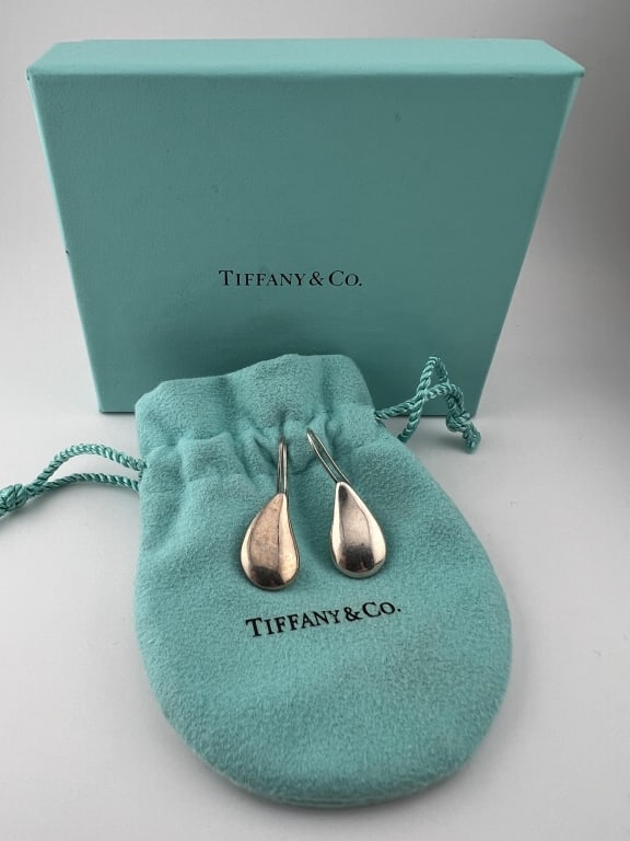 Tiffany & Co Sterling Silver Elsa Peretti Earrings: Pair of Tiffany & Co Sterling Silver Elsa Peretti Earrings. Signed on the backs, TIFFANY & CO STERLING PERETTI. Comes with dust cover and box. Each earring measures approximately 1.5 inches in length.