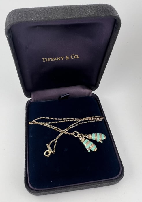 Tiffany & Co Sterling Silver Pair Gloves Necklace: Tiffany & Co Sterling Silver Pair Gloves Necklace. Sterling silver and enamel pair of gloves / mittens necklace pendant or charms on chain. The mittens are signed T & Co 925 and the chain is signed TI