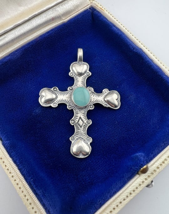 Native American Sterling Turquoise Cross Pendant: Native American Sterling Turquoise Cross Pendant. Sterling silver and turquoise, heart design elements, Native American or style. Measures just over 2 inches in length.