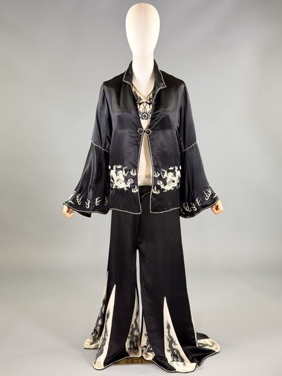 Antique 1920s Silk Satin Chinese Pajama Lounge Set: Antique 1920s Silk Satin Chinese Pajama Lounge Set having sleeveless top with single heart pocket and contrast black dragon embroidery around neckline. Pants have waist yoke wide legs with contrast wh