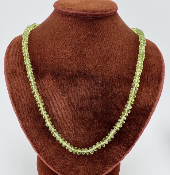 Estate 14K Gold & Peridot Necklace Strand: Estate 14K Gold & Peridot Necklace Strand Clasp is hallmarked 14k gold. Set with hand cut briolette peridot beads. Measures just over 15 inches in length.