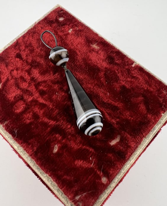 Antique 19th Century Banded Agate Necklace Pendant: Antique 19th Century Banded Agate Necklace Pendant Mid to late Victorian Era banded black and white agate necklace pendant with bead and tear drop design. Measures approximately 2 inches in length.