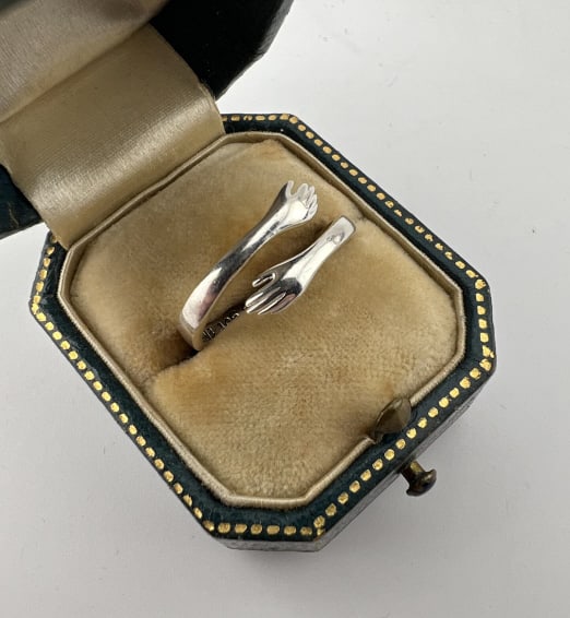 Figural Sterling Silver Hug Design Ring: Figural Sterling Silver Hug Design Ring Interior description, "You've fucking got this." Stamped 925. Currently a ring size 6 but slightly adjustable.