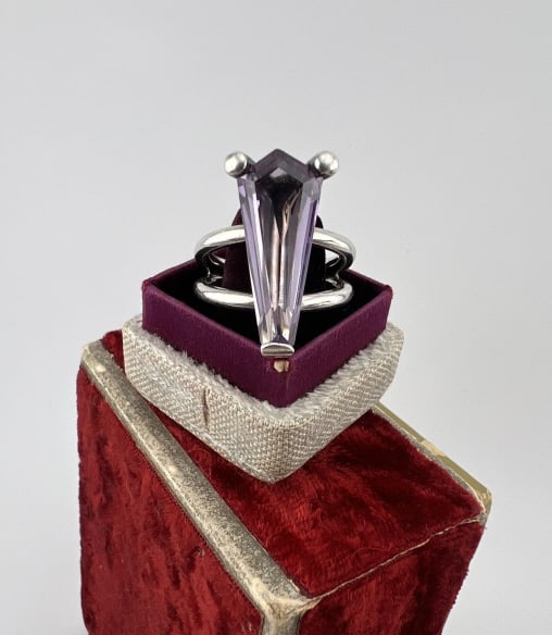 Sterling Silver Coffin Motif Solitaire Ring: Sterling Silver Coffin Motif Solitaire Ring Interior is stamped 925 and also signed. Set with synthetic stone meant to resemble alexandrite. Ring size 6.25.
