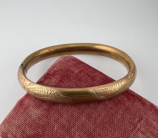Antique C 1900 Yellow Gold Filled Bangle Bracelet: Antique C 1900 Yellow Gold Filled Bangle Bracelet. Hinged opening. Chased / engraved design across the top. Measures 2.5 inches across the interior opening.