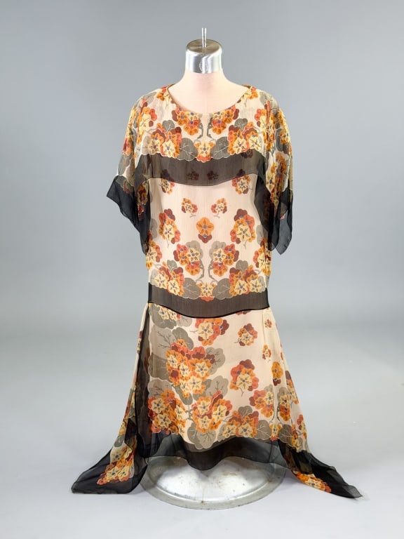 Antique 1920s Silk Chiffon Floral Print Dress: Antique 1920s Silk Chiffon Floral Print Dress having cape detail at shoulders with drop waist, fully lined throughout. Measuring 38 inch bust, 34 inch drop waist, 39 inches long, 15 inch sleeve length
