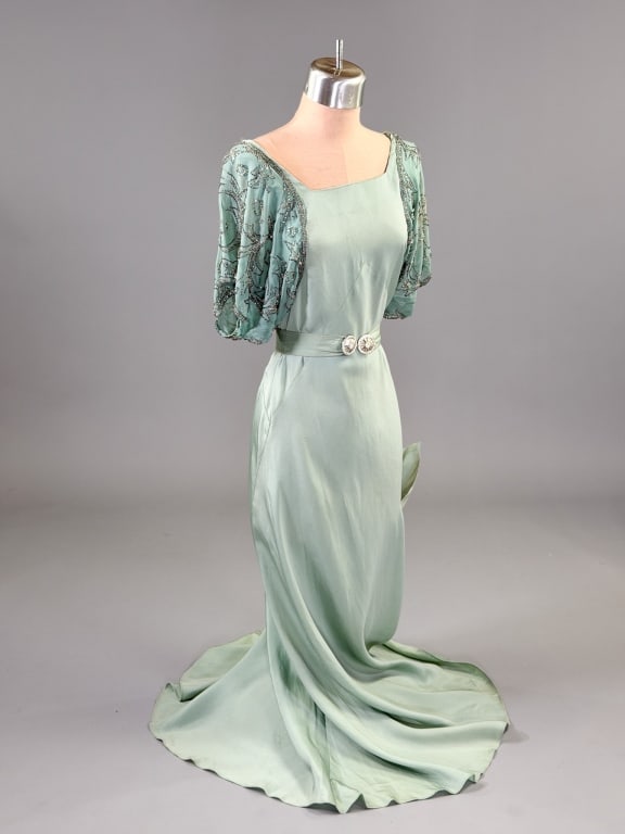 Vintage 1930s Silk Crepe Beaded Bias Cut Dress: Vintage 1930s Silk Crepe Beaded Bias Cut Dress having beaded sleeves with side snap closure and belt at waist, bias cut with stretch throughout. Measuring 32 - 36 inch bust, 26 - 34 inch waist, 52 inc