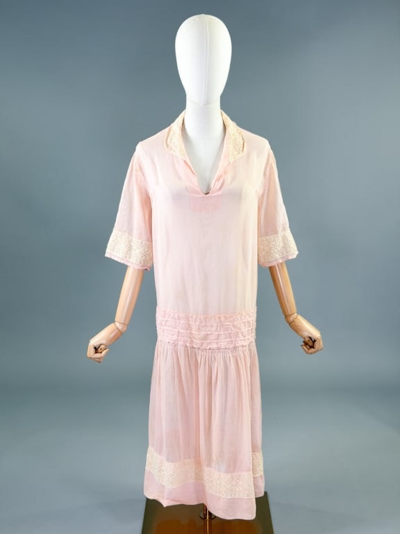 Antique 1920s Cotton Drop Waist Lace Day Dress: Antique 1920s Cotton Drop Waist Lace Day Dress having lace details throughout with drop waist and attached tie. No closures, slides over head. Measuring 50 inch bust, 50 inch drop waist, 43 inches lon