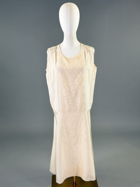 Antique 1920s Silk Lace Drop Waist Flapper Dress: Antique 1920s Silk Lace Drop Waist Flapper Dress having sleeveless armholes with lace detail down center front, no closures slides over head. Measuring 40 inch bust, 38 inch waist, 42 inches long. Gen