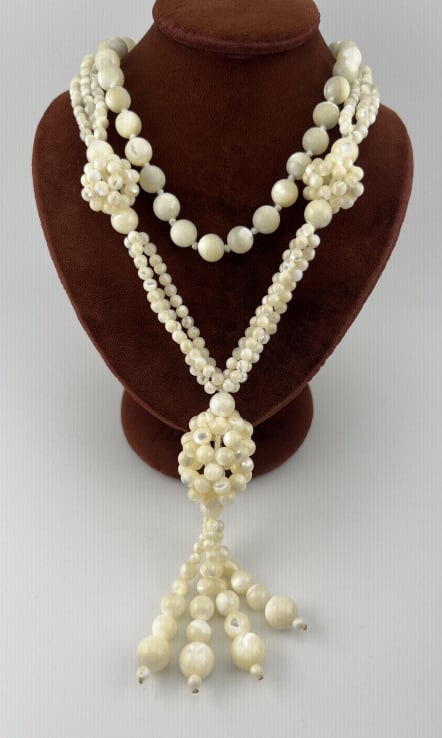 Vintage Mother of Pearl Necklace w Tassel Pendant: Vintage Mother of Pearl Necklace w Tassel Pendant. Measures 27 inches in length plus 3.75 inches pendant / tassel drop.